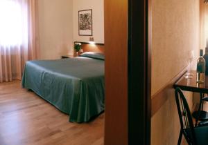 Cama o camas de una habitación en Hotel Nuova Grosseto