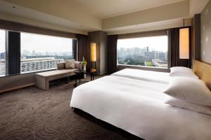 Postel nebo postele na pokoji v ubytování The Capitol Hotel Tokyu + 37 fotografií