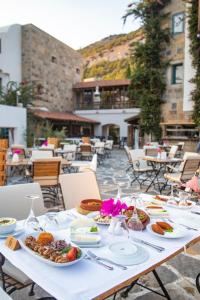 a table with plates of food on top of it at Hapimag Sea Garden Resort in Yaliciftlik