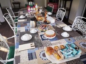 a table with a table cloth with food on it at Villa Margherita in San Giovanni Teatino