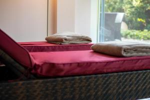 Una cama o camas en una habitación de Vitalhotel Quellengarten - Bed & Breakfast