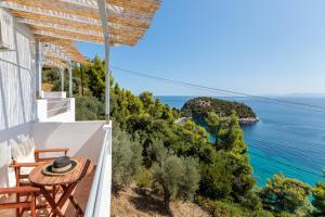 a view of the ocean from the balcony of a house at Kalithea Studios in Stafylos
