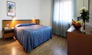 Cama o camas de una habitación en Hotel Nuova Grosseto