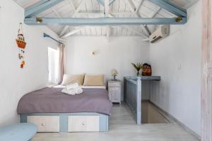 Postel nebo postele na pokoji v ubytování Pigi Cottage