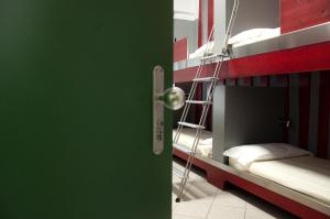 a room with a bunk bed with a ladder at Roma Scout Center in Rome