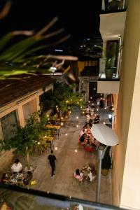 an overhead view of a restaurant with people sitting at tables at Old Port Hotel in Limassol