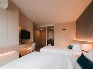 Postel nebo postele na pokoji v ubytování 56 Hotel