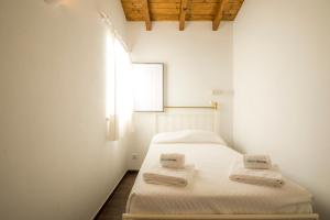 Postel nebo postele na pokoji v ubytování C14 - Casa da Luz