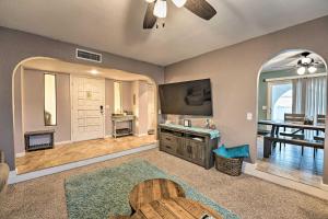 a large living room with a television and a table at Havasu Getaway with Fire Pit and Grill Less Than 3 Mi to Lake in Lake Havasu City