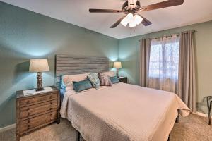 a bedroom with a bed and a ceiling fan at Havasu Getaway with Fire Pit and Grill Less Than 3 Mi to Lake in Lake Havasu City