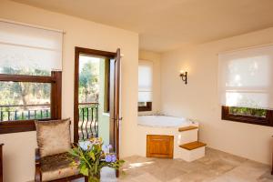 een badkamer met een bad en een raam bij Room in BB - Exclusive Boutique Hotel in Fethiye