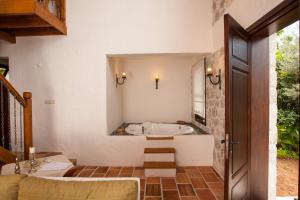 a bathroom with a tub and a sink at Exclusive Boutique Hotel 3 in Fethiye