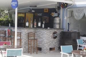 a bar with bottles of alcohol on a brick wall at Gözde Butik Otel Belek in Belek