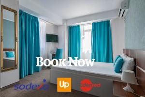 TV a/nebo společenská místnost v ubytování Hotel Bordeaux