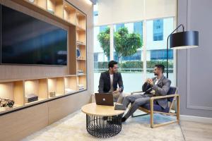TV a/nebo společenská místnost v ubytování Holiday Inn Express Pune Hinjewadi by IHG