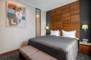 Postel nebo postele na pokoji v ubytování CITYHOTEL