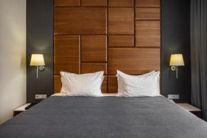 Postel nebo postele na pokoji v ubytování CITYHOTEL