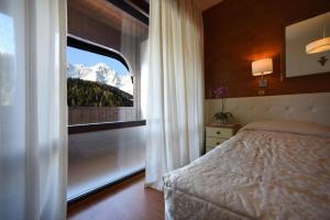 Postel nebo postele na pokoji v ubytování Hotel Corona
