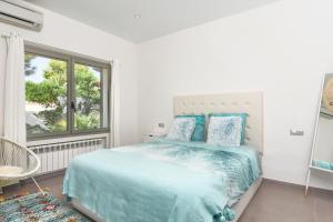 Posteľ alebo postele v izbe v ubytovaní Graham Holiday Rentals - Baladrar