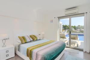 Posteľ alebo postele v izbe v ubytovaní Graham Holiday Rentals - Baladrar