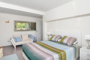 Posteľ alebo postele v izbe v ubytovaní Graham Holiday Rentals - Baladrar