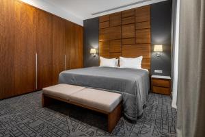 Postel nebo postele na pokoji v ubytování CITYHOTEL