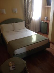 Postel nebo postele na pokoji v ubytování SIRIOHotel