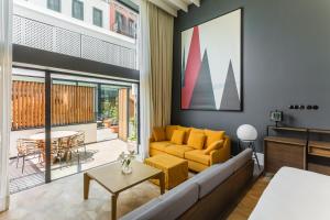 a living room with a couch and a table at Room Mate Emir in Istanbul