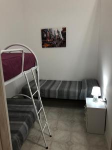 A bed or beds in a room at Planet casa vacanze
