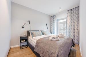 Postel nebo postele na pokoji v ubytování Gardenia, Sun & Snow