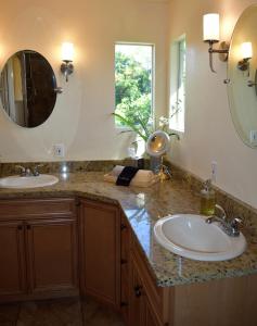 a bathroom with two sinks and a mirror at Eagles Nest Florida in Naples