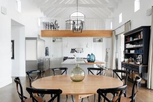 a kitchen and dining room with a table and chairs at Boschendal Farm Estate in Franschhoek