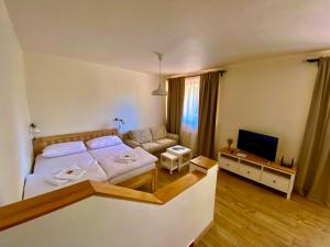 Posteľ alebo postele v izbe v ubytovaní Apartmány Lipno 46
