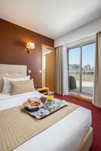 Postel nebo postele na pokoji v ubytování Stay Hotel Leiria Centro