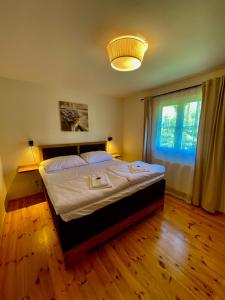 Posteľ alebo postele v izbe v ubytovaní Apartmány Lipno 46