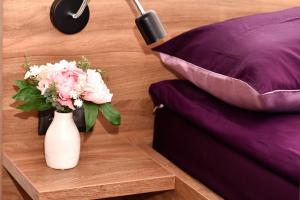 Łóżko lub łóżka w pokoju w obiekcie VIP Apartament number 9