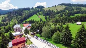 an aerial view of a resort in the mountains at Resort EuroPark Fundata in Fundata