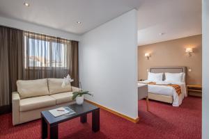 Postel nebo postele na pokoji v ubytování Stay Hotel Leiria Centro