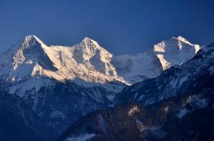 a group of mountains with snow on them at Hotel Rössli in Interlaken
