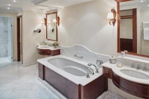 a bathroom with a large tub and a sink at Villa San Michele, A Belmond Hotel, Florence in Fiesole