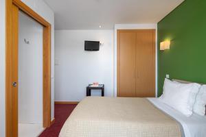 Postel nebo postele na pokoji v ubytování Stay Hotel Leiria Centro