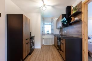 Kuchyň nebo kuchyňský kout v ubytování Honey apartments