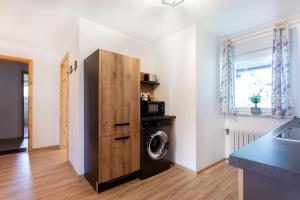Kuchyň nebo kuchyňský kout v ubytování Honey apartments