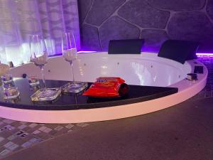 a large white tub sitting next to a white wall at TH LUXURY fly in Catania