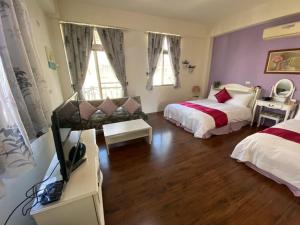 小城堡民宿Little Castle hotel 19窩窩近東大門夜市好停車房間的床