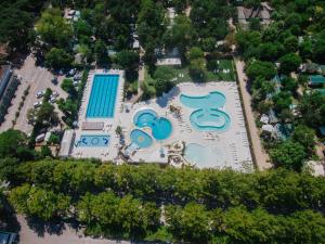 an aerial view of a resort with a pool at Camping Sabbiadoro in Lignano Sabbiadoro
