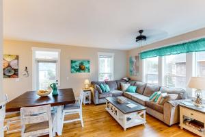 a living room with a couch and a table at Mermaids Grotto in Lincoln City