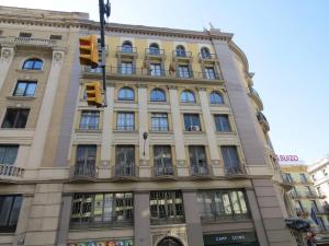 a building with a traffic light in front of it at Pensión Casa Blanca in Barcelona