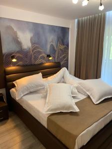 Postel nebo postele na pokoji v ubytování Doftana Apartaments