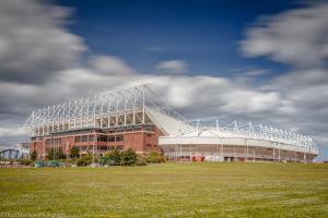 - un grand bâtiment avec un terrain de football en face dans l'établissement Milburn Cottage 2- Luxury Accommodation, à Monkwearmouth